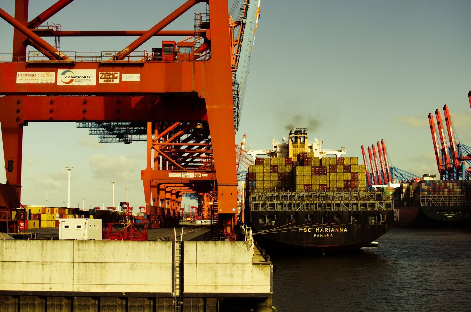 Container ship being unloaded at an international port